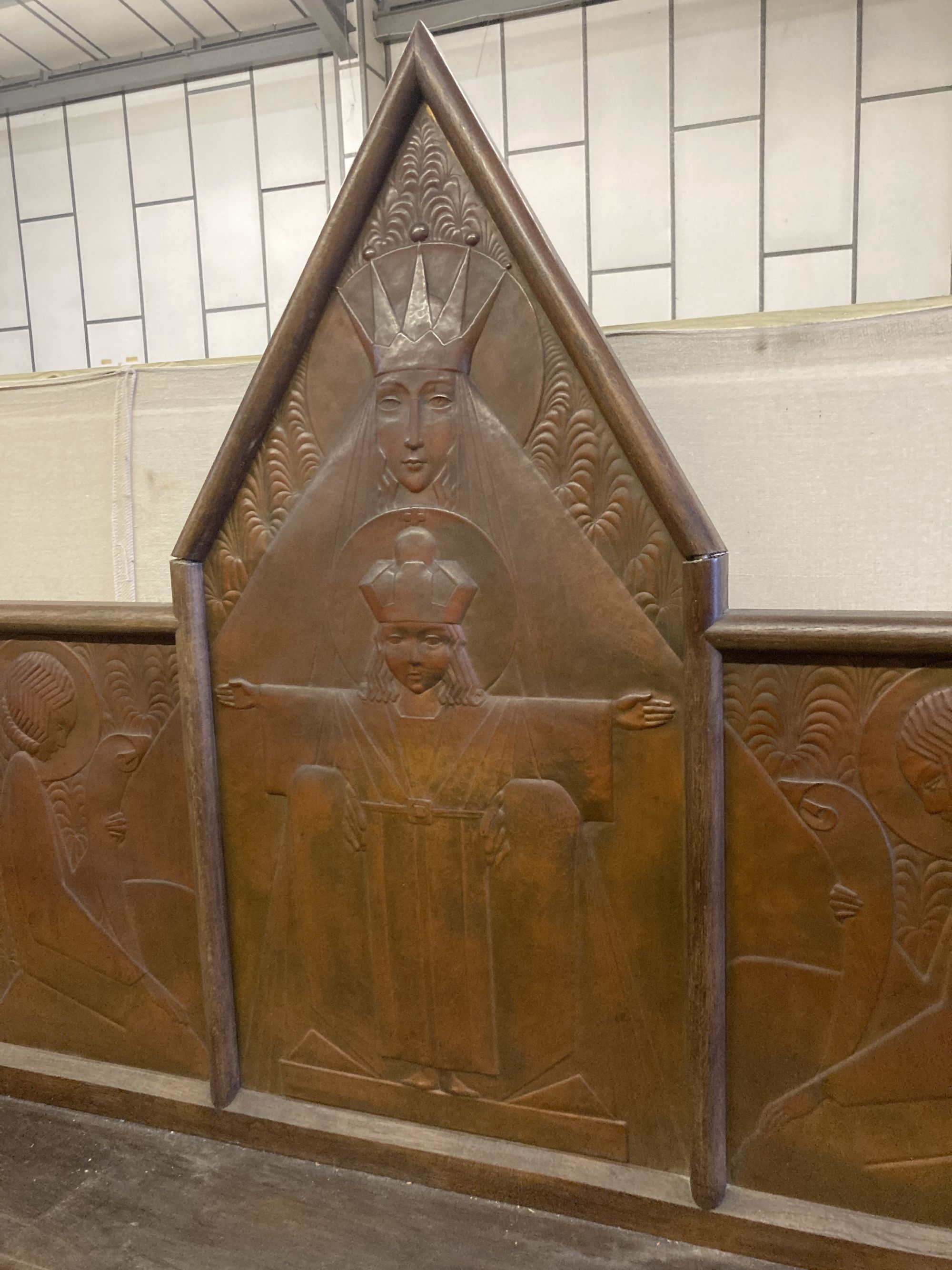 An Arts & Crafts oak and embossed copper triptych by Felix Jacques, signed and dated 1928, width 175cm, depth 26cm, height 112cm